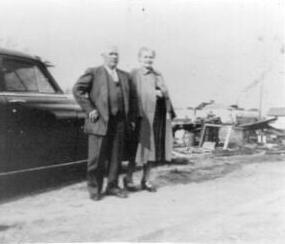 John Herbert and Emma Pearl (Ingram) Smith surveying the damage immediately after the tornado of 1952 which severely damaged their house