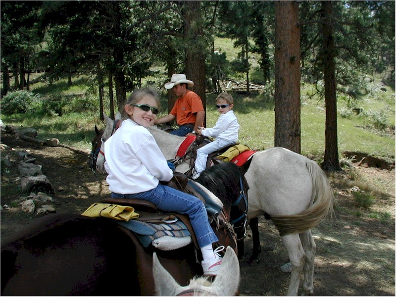 Eve and Henry on horseback, August 2001
