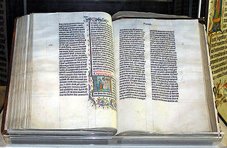 A Bible handwritten in Latin, on display in Malmesbury Abbey, Wiltshire, England. The Bible was written in Belgium in 1407, for reading aloud in a monastery.